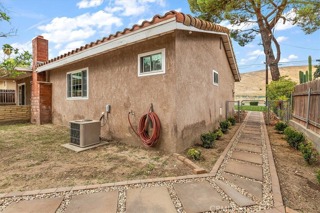 2914 West Wilson Street Banning, CA 92220 - Photo 26 of 31 a backyard of a house with potted plants