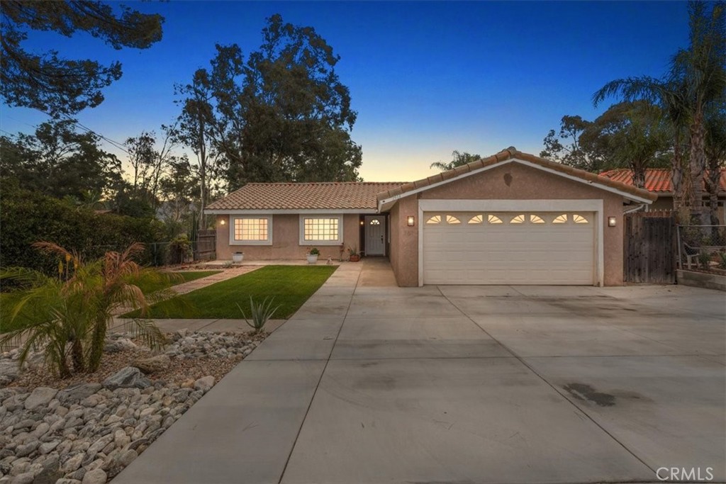 2914 West Wilson Street Banning, CA 92220 - Photo 30 of 31 a front view of a house with a garden