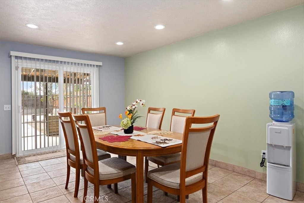 2914 West Wilson Street Banning, CA 92220 - Photo 7 of 31 a view of a dining room with furniture and wooden floor