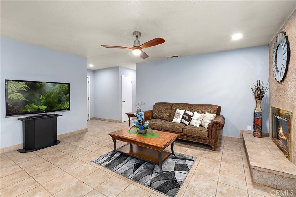 2914 West Wilson Street Banning, CA 92220 - Photo 9 of 31 a living room with furniture and a flat screen tv