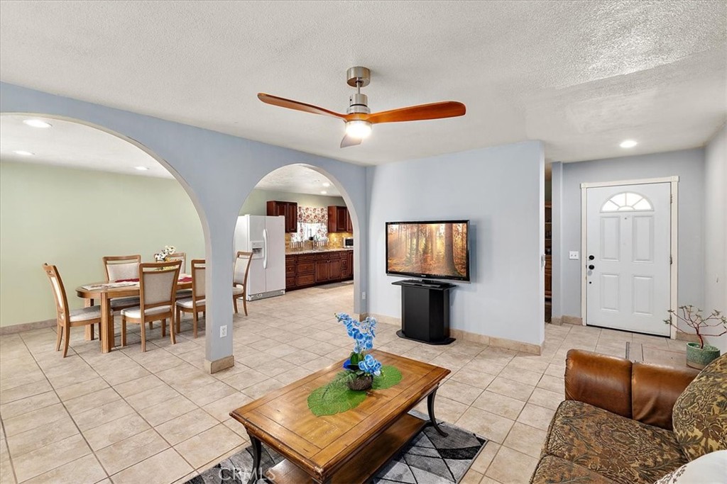 2914 West Wilson Street Banning, CA 92220 - Photo 10 of 31 a living room with furniture and a flat screen tv