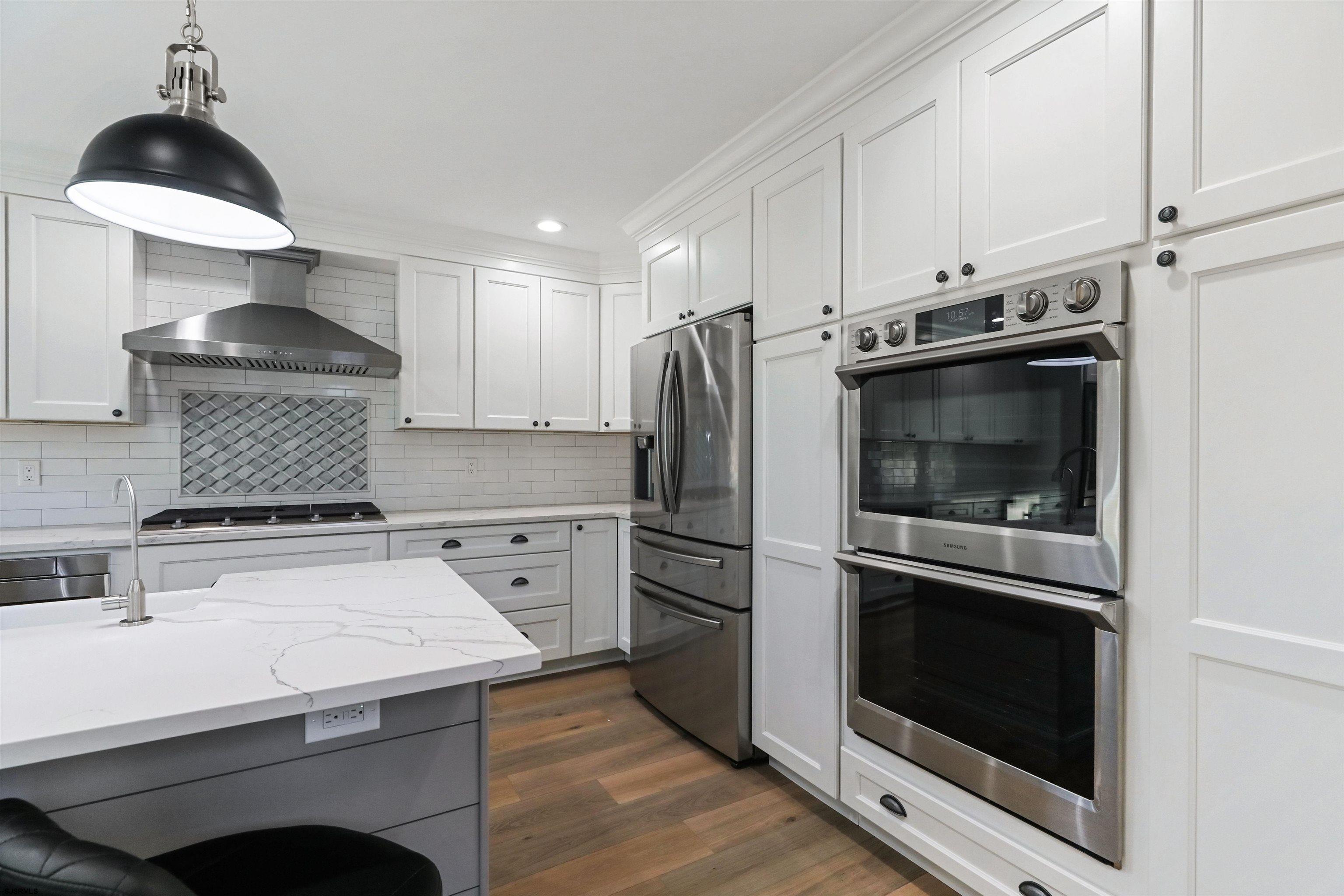 34 Kay Drive Hammonton, NJ 08037 - Photo 11 of 23 a kitchen with a stove and a refrigerator