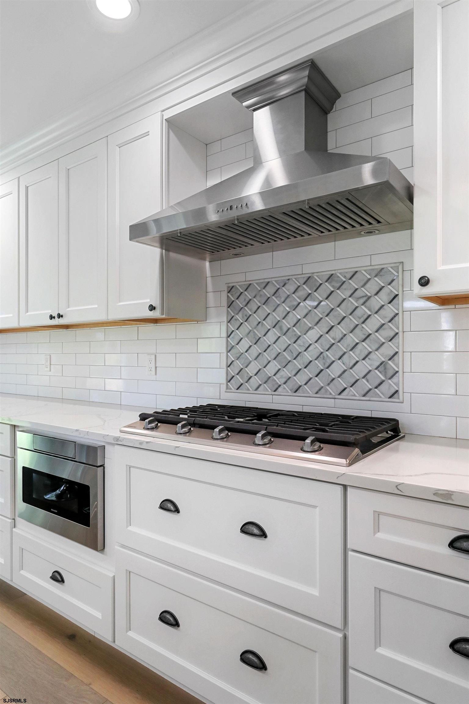 34 Kay Drive Hammonton, NJ 08037 - Photo 12 of 23 a stove top oven sitting inside of a kitchen
