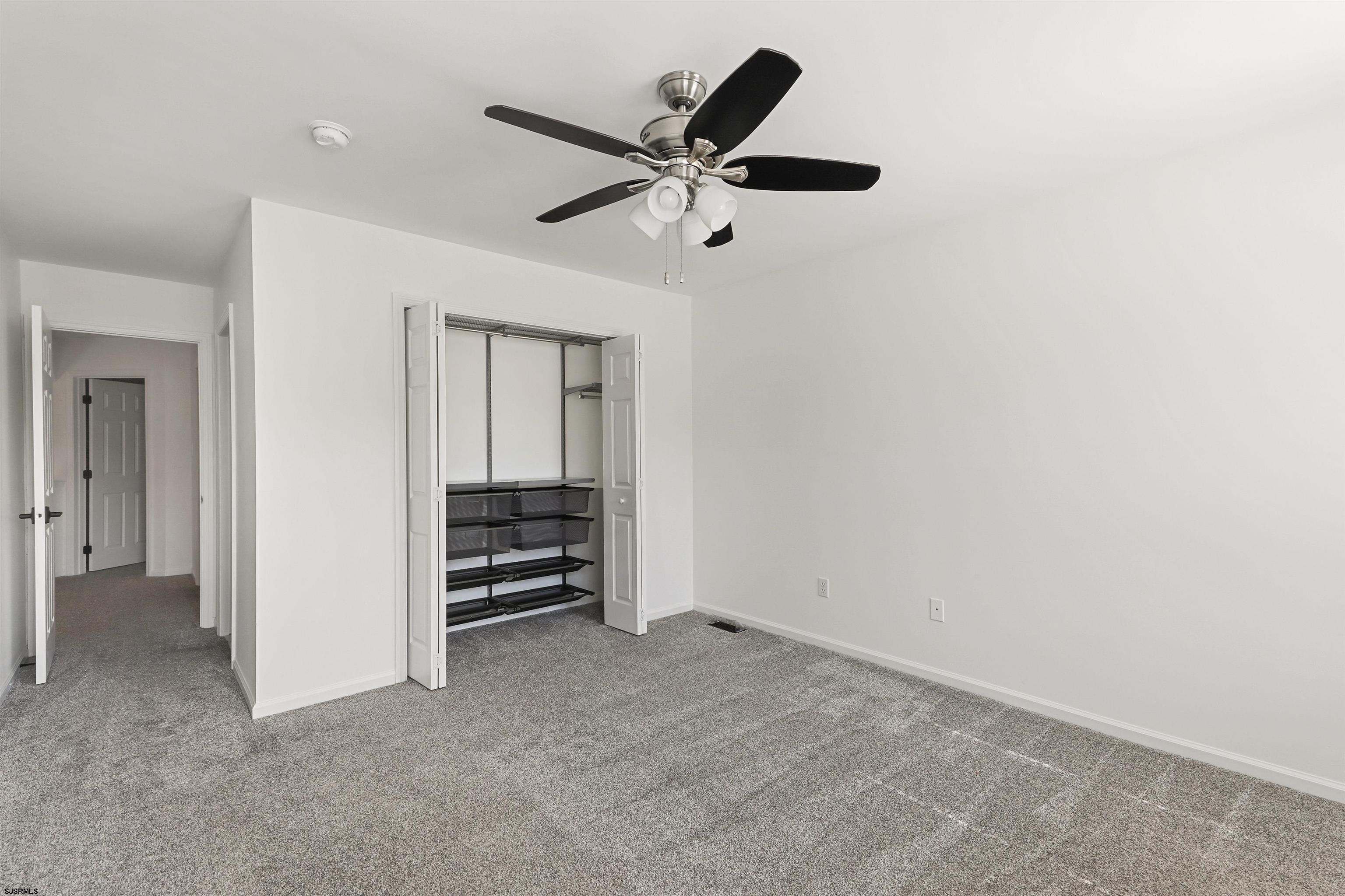 34 Kay Drive Hammonton, NJ 08037 - Photo 16 of 23 an empty room with closet and ceiling fan