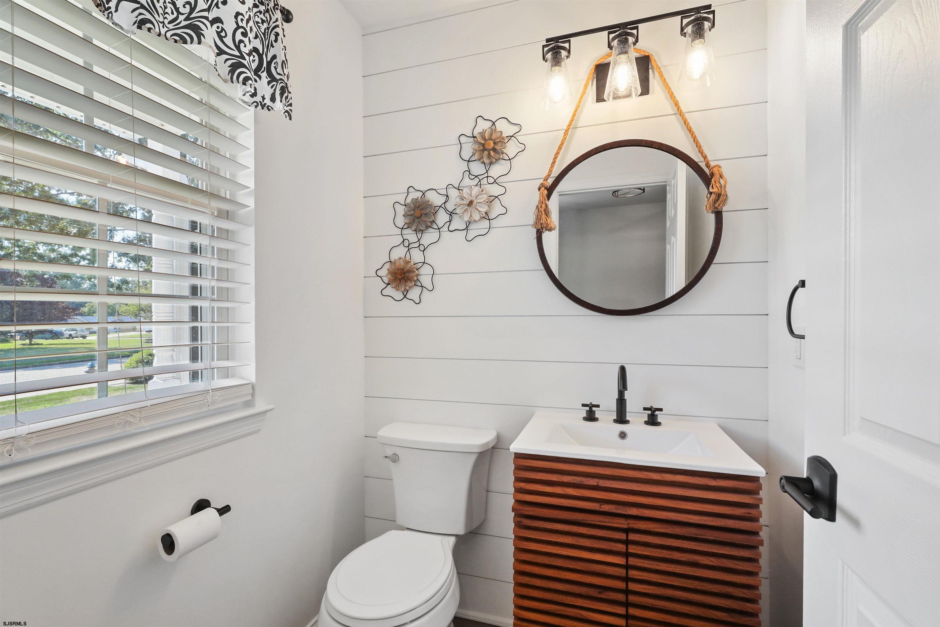 34 Kay Drive Hammonton, NJ 08037 - Photo 19 of 23 a bathroom with a toilet sink and mirror