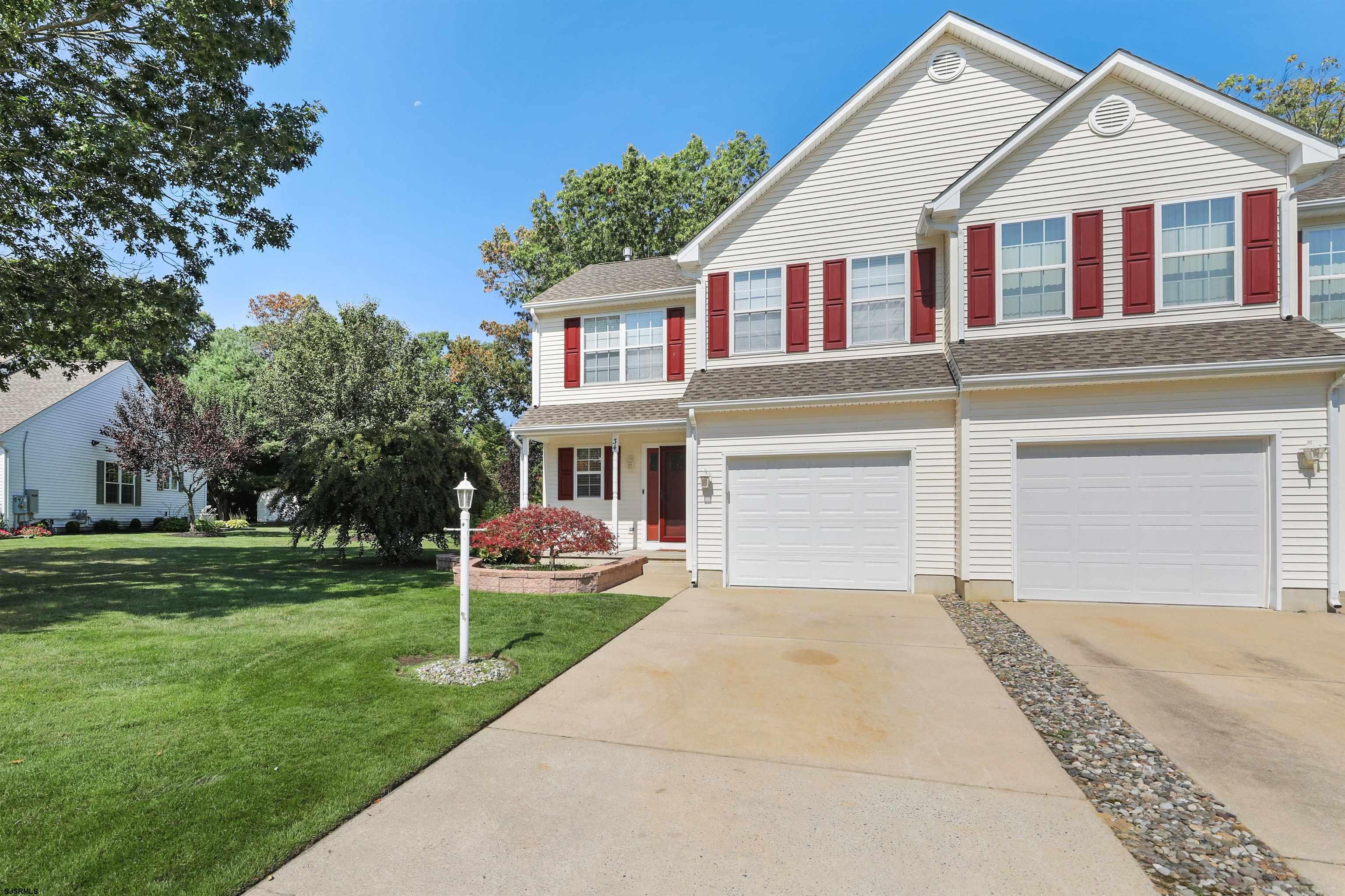 34 Kay Drive Hammonton, NJ 08037 - Photo 2 of 23 a front view of a house with a garden and trees
