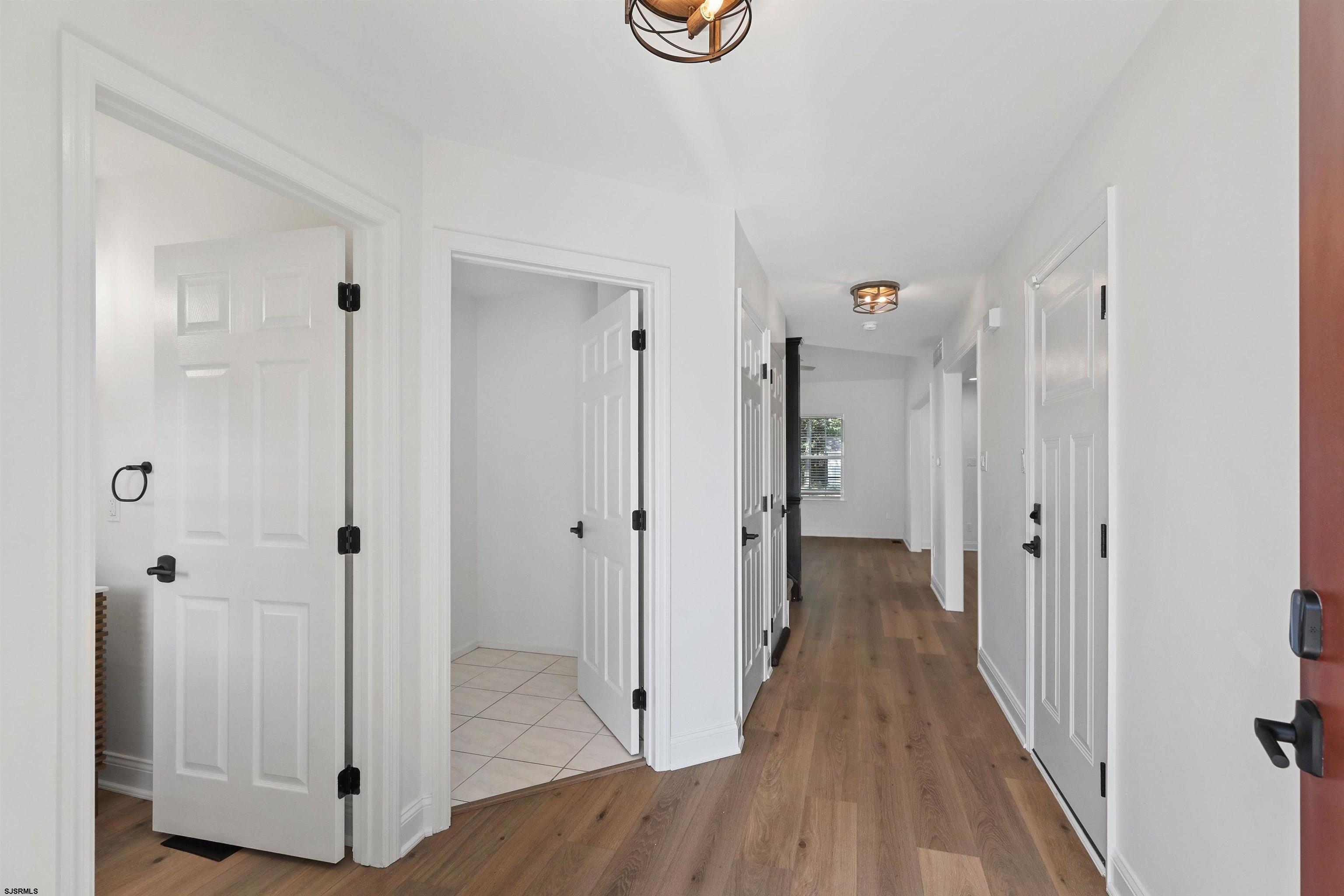 34 Kay Drive Hammonton, NJ 08037 - Photo 3 of 23 a view of a hallway with wooden floor and closet area