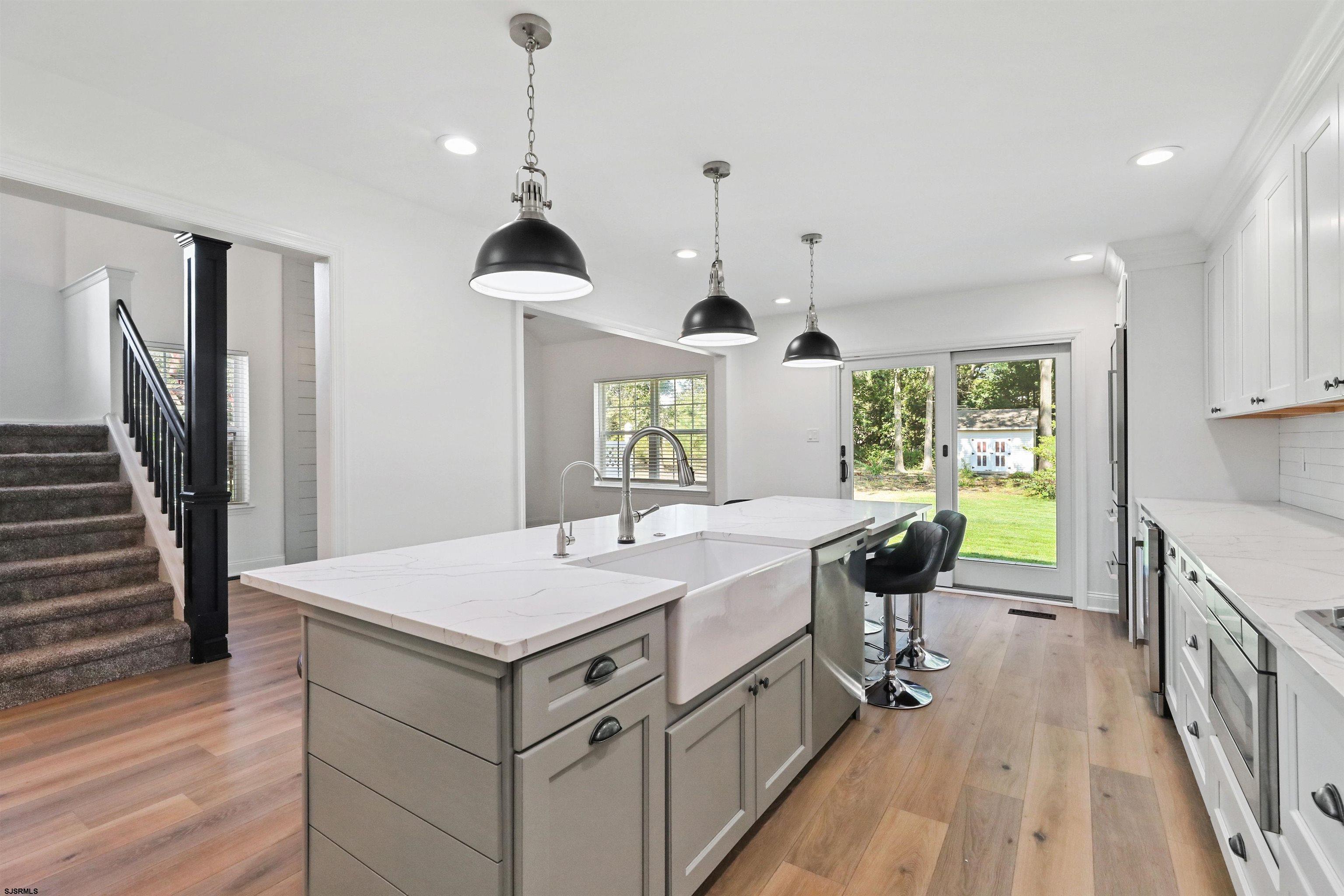 34 Kay Drive Hammonton, NJ 08037 - Photo 7 of 23 a open kitchen with a sink a stove and chairs