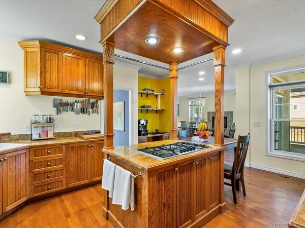 a kitchen that has a table and chairs in it