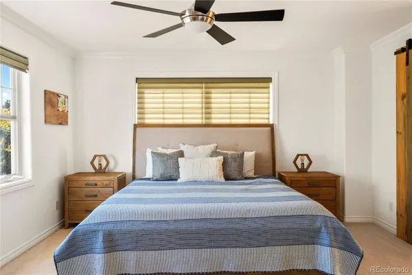 a bedroom with a bed and window