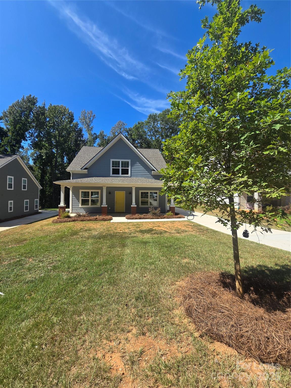 Undisclosed Address Waxhaw, NC 28173 - Photo 2 of 22 a front view of a house with a garden