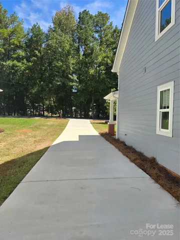 a view of a swimming pool with an outdoor space and seating area