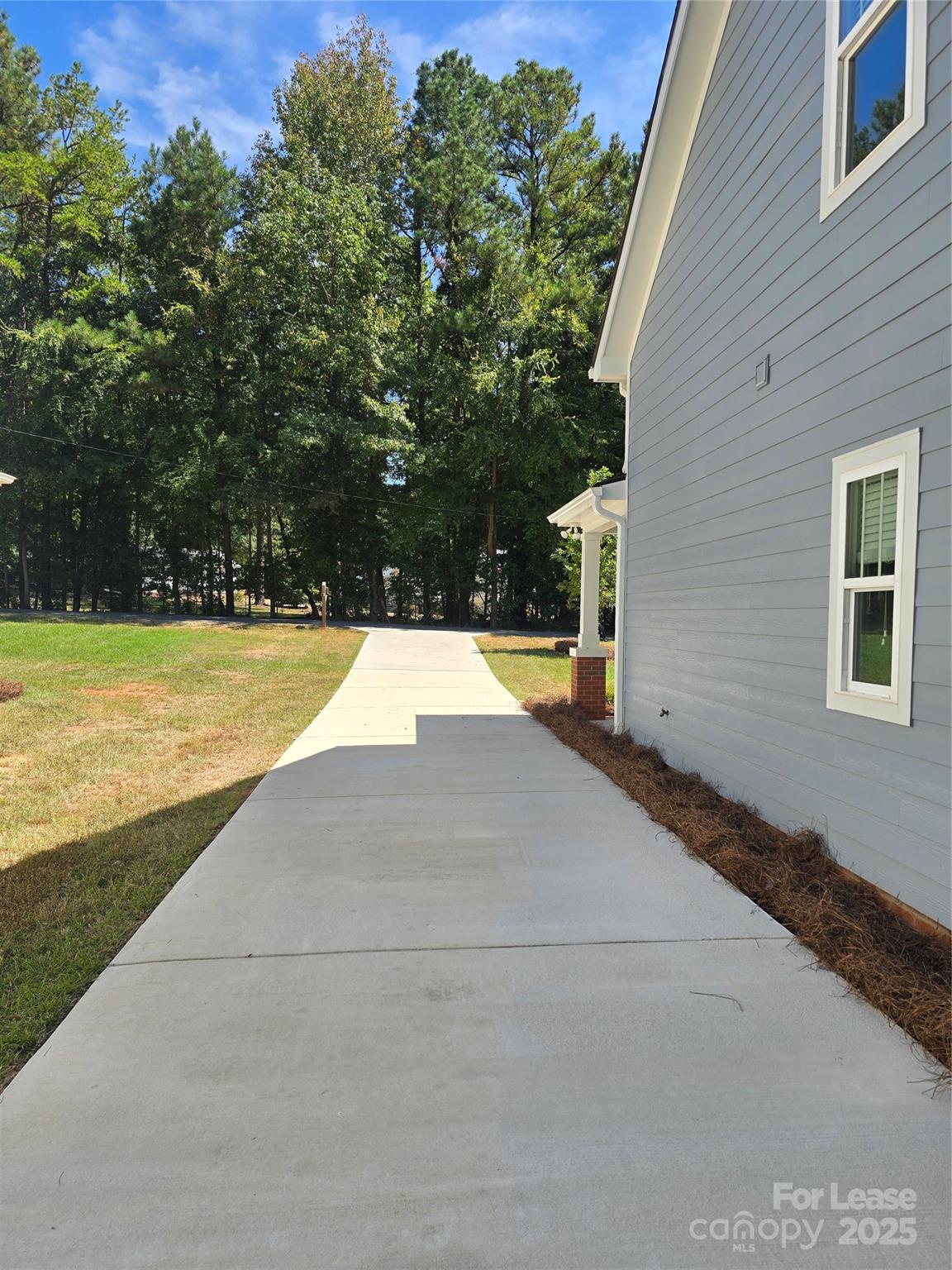 Undisclosed Address Waxhaw, NC 28173 - Photo 3 of 22 a view of a swimming pool with an outdoor space and seating area