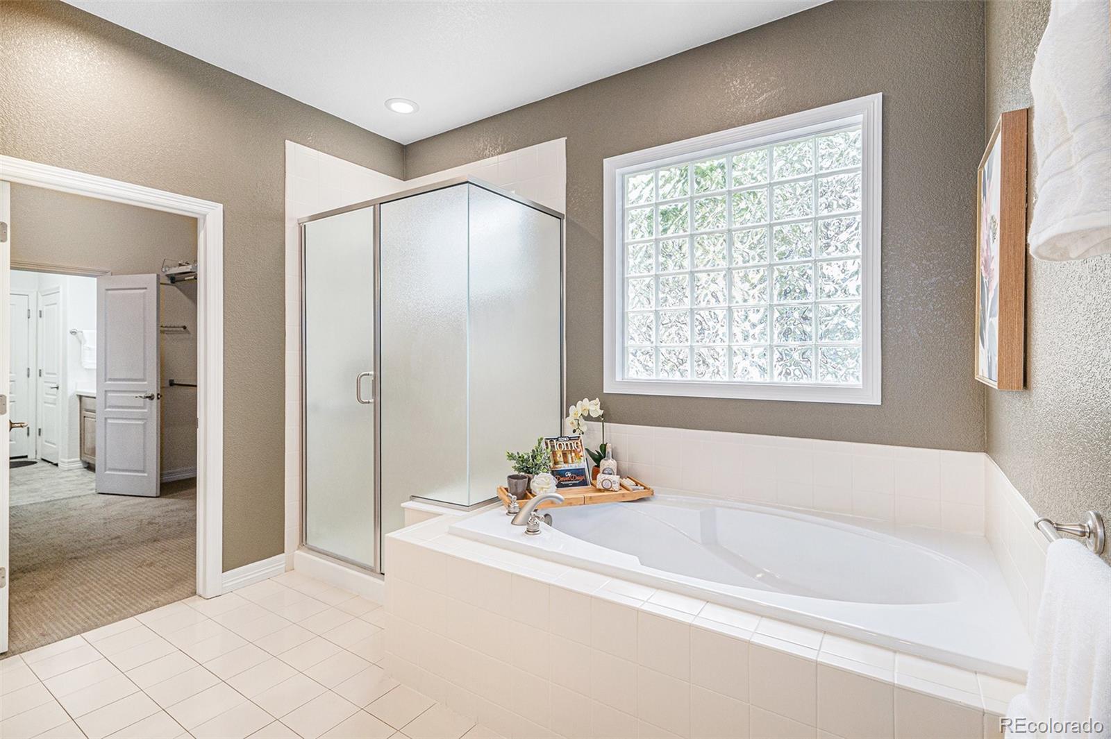 529 Uinta Way Denver, CO 80230 - Photo 12 of 37 a white bath tub sitting next to a window