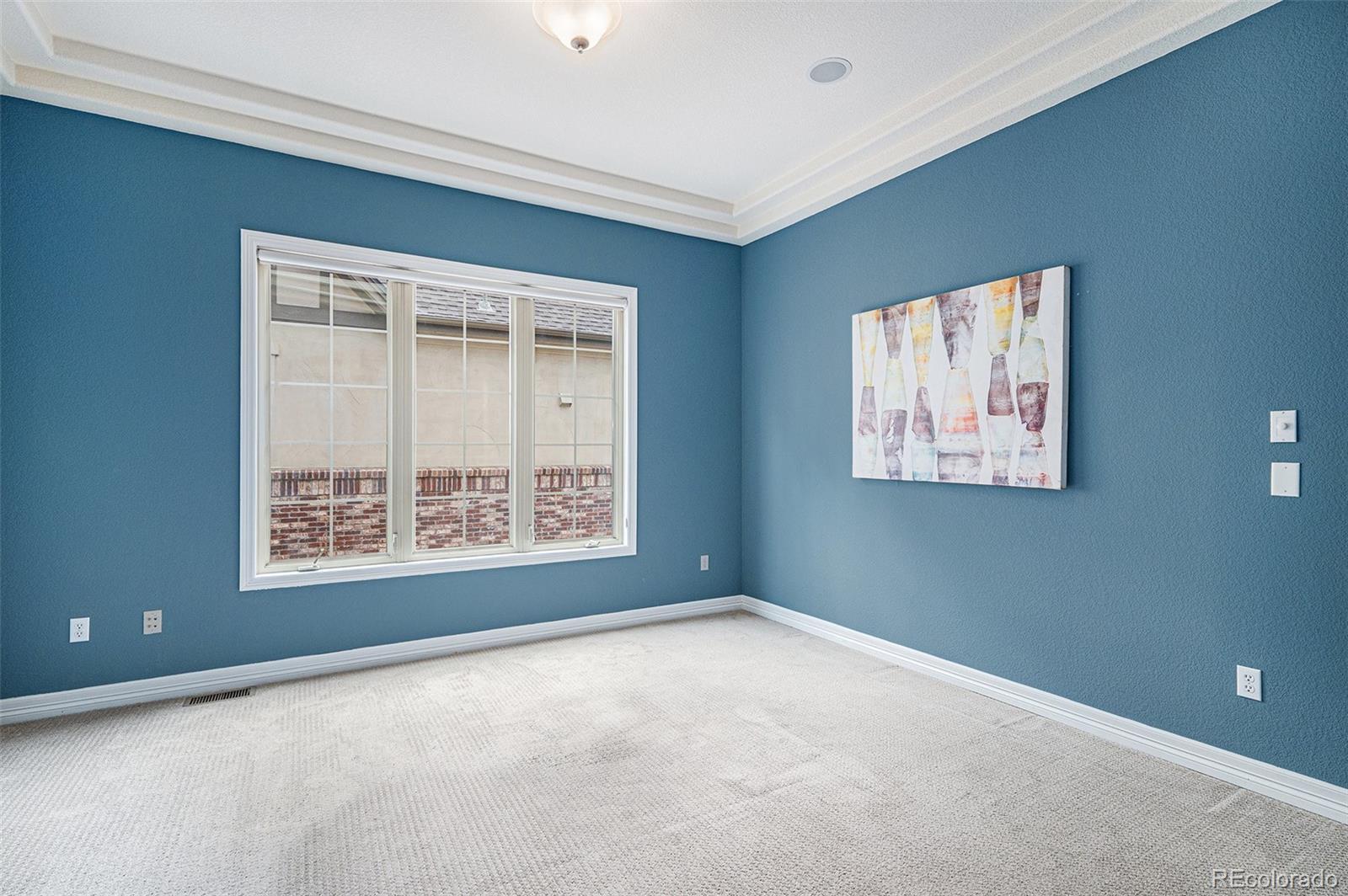 529 Uinta Way Denver, CO 80230 - Photo 14 of 37 a view of an empty room with a window