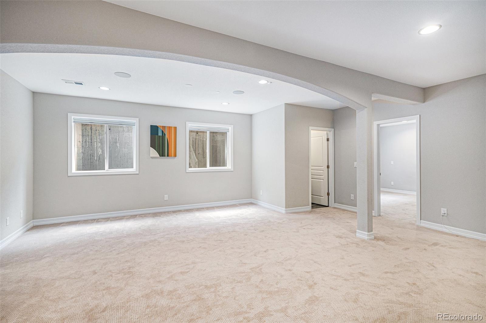 529 Uinta Way Denver, CO 80230 - Photo 17 of 37 a view of an empty room with a window