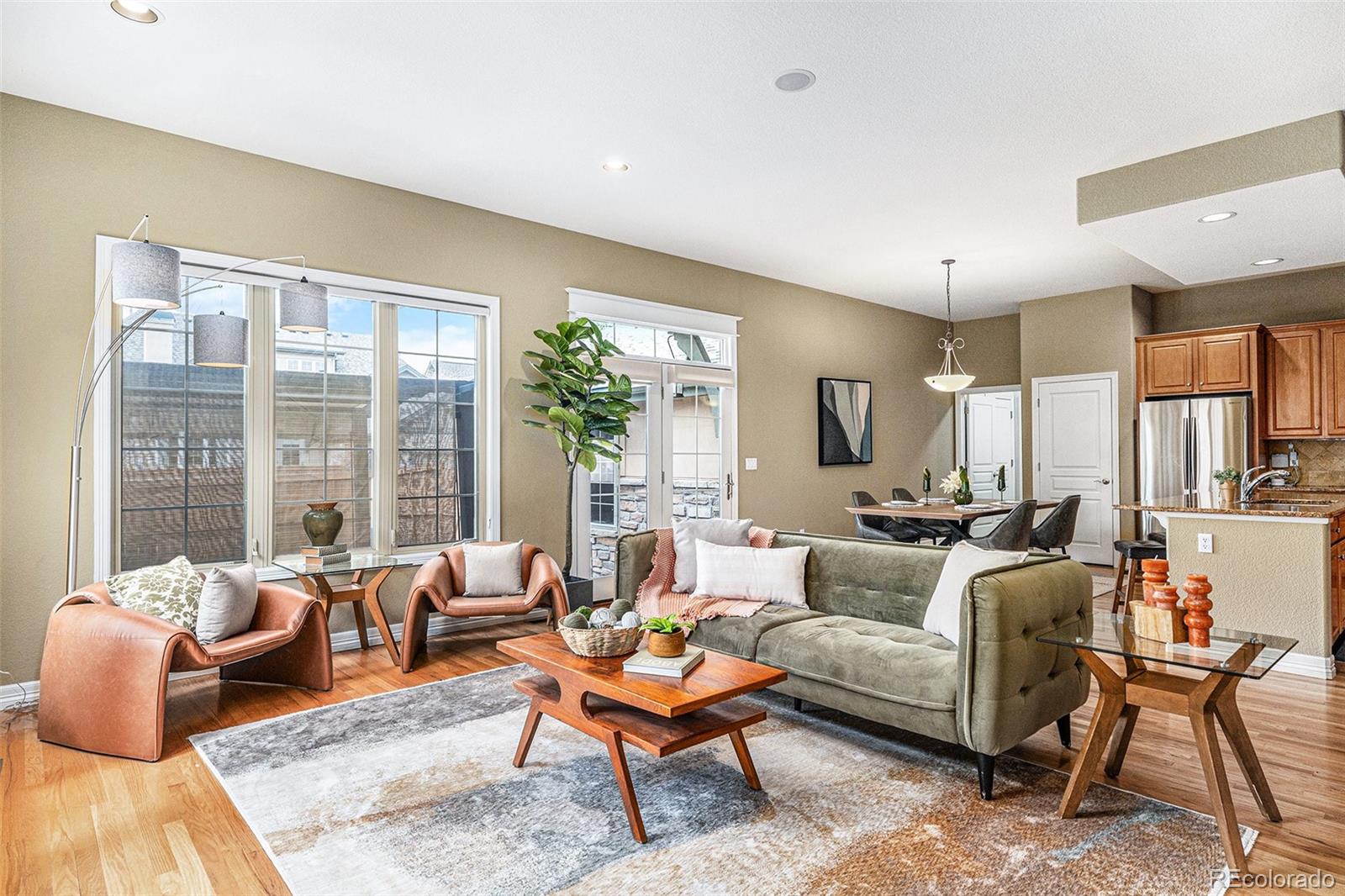 a living room with furniture couches and a flat screen tv