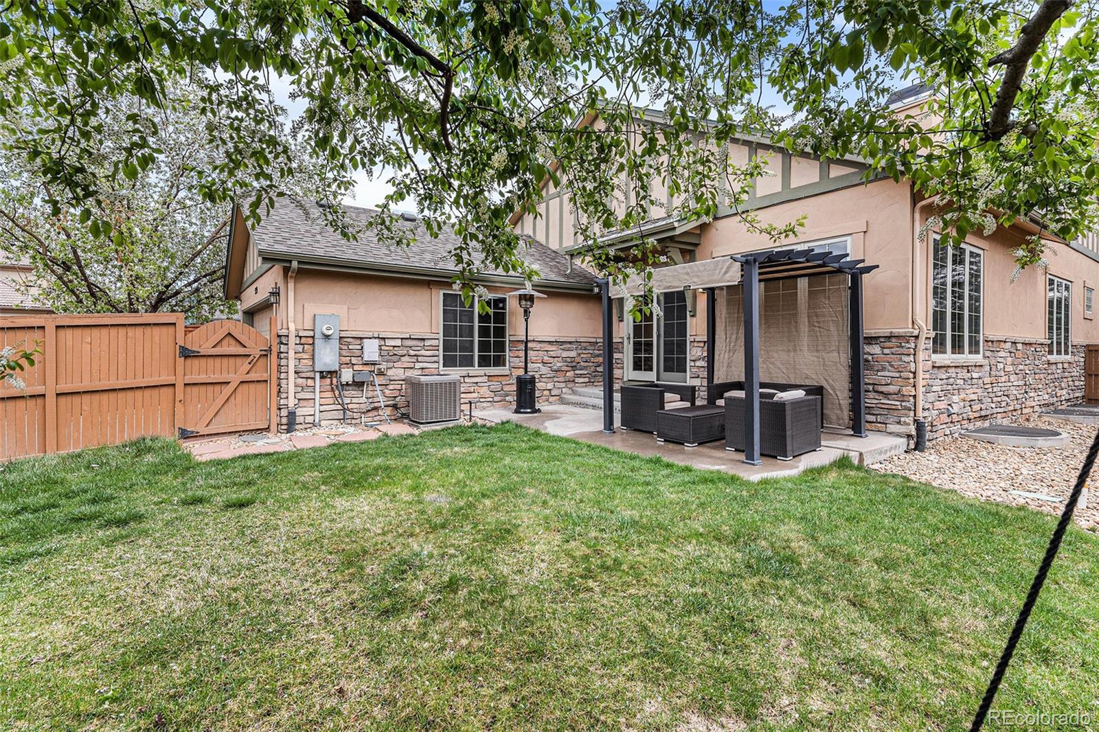 529 Uinta Way Denver, CO 80230 - Photo 25 of 37 a view of a house with backyard and a tree