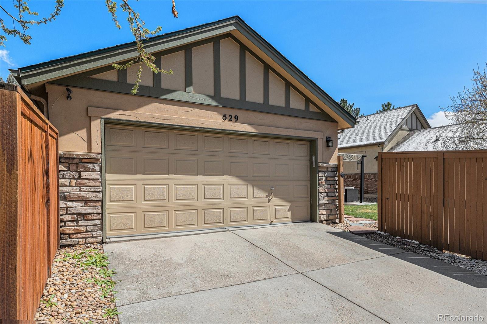 529 Uinta Way Denver, CO 80230 - Photo 26 of 37 a view of house with garage