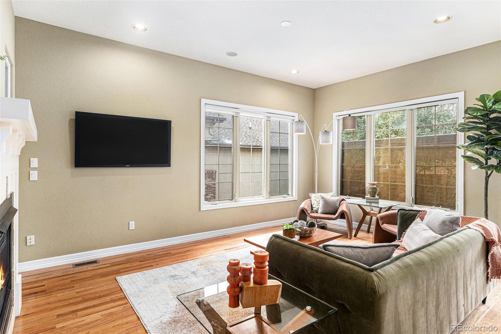 529 Uinta Way Denver, CO 80230 - Photo 4 of 37 a living room with furniture and a flat screen tv