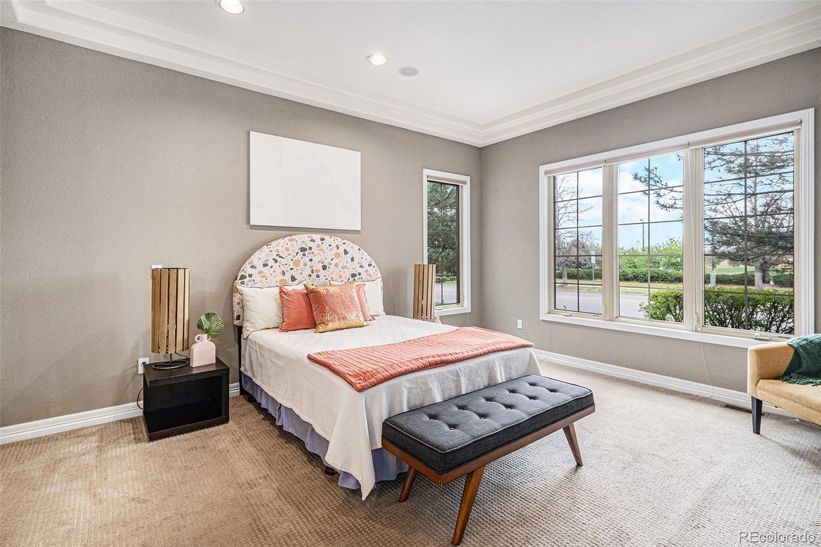 529 Uinta Way Denver, CO 80230 - Photo 10 of 37 a bedroom with a bed and a large window