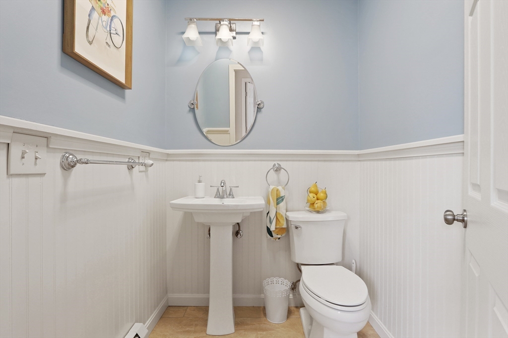 96 Brantwood Road Worcester, MA 01602 - Photo 12 of 33 a white toilet sitting next to a bathroom sink