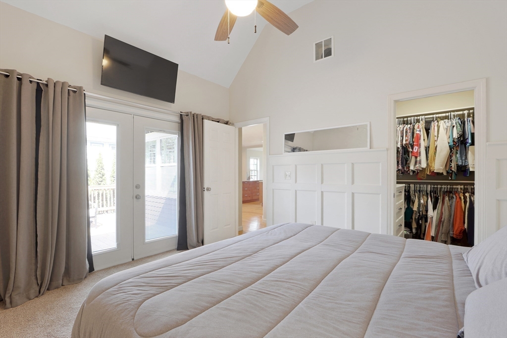 96 Brantwood Road Worcester, MA 01602 - Photo 13 of 33 a bedroom with a bed and a large mirror