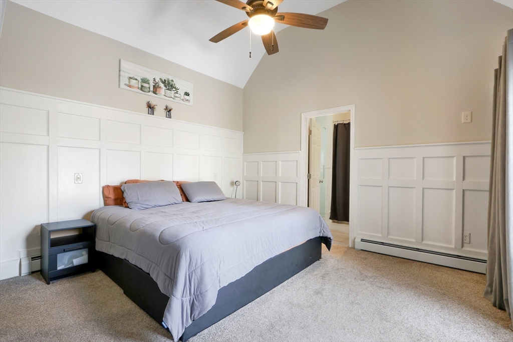 96 Brantwood Road Worcester, MA 01602 - Photo 14 of 33 a spacious bedroom with a bed and a chandelier