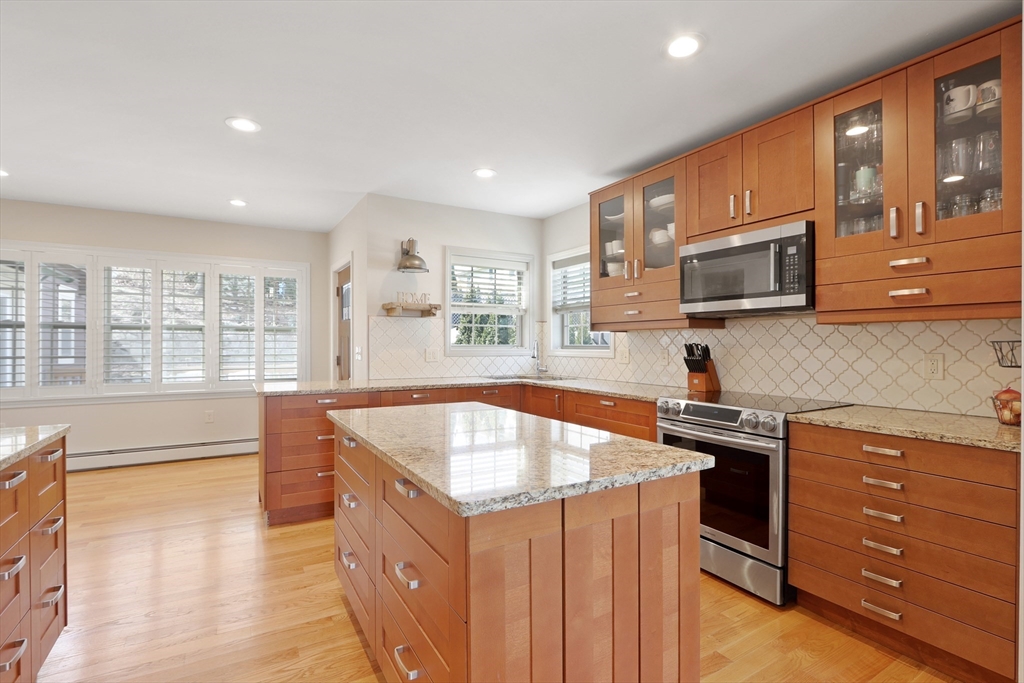 96 Brantwood Road Worcester, MA 01602 - Photo 2 of 33 a kitchen with stainless steel appliances granite countertop a sink stove and microwave