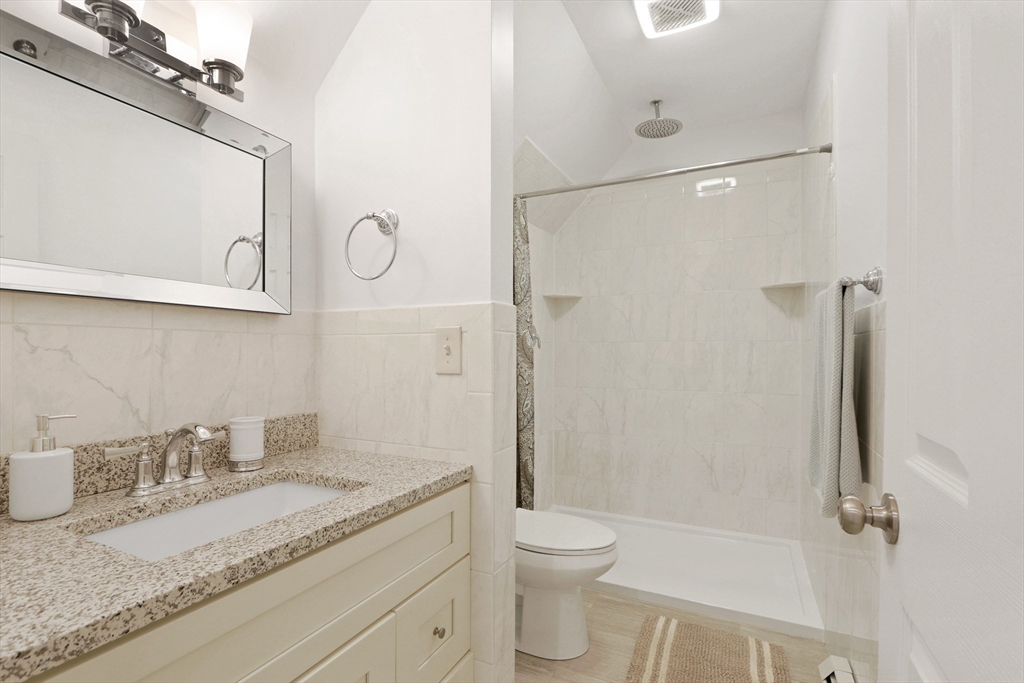 96 Brantwood Road Worcester, MA 01602 - Photo 23 of 33 a bathroom with a granite countertop sink toilet and shower