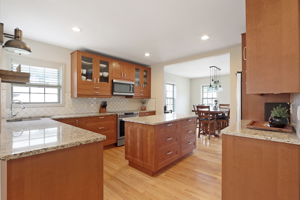96 Brantwood Road Worcester, MA 01602 - Photo 3 of 33 a kitchen with stainless steel appliances granite countertop sink stove top oven and cabinets