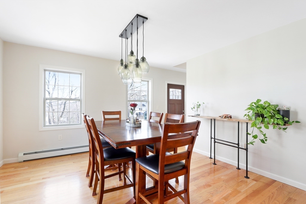 96 Brantwood Road Worcester, MA 01602 - Photo 7 of 33 a view of a dining room with furniture and a potted plant