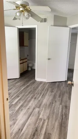 a view of a livingroom with an empty space and a window