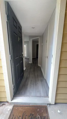 a view of a hallway view with staircase