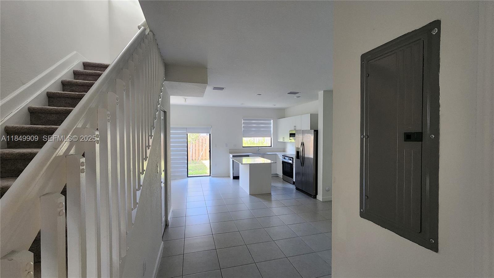 12897 Southwest 234th Street, Unit 12897 Homestead, FL 33032 - Photo 15 of 24 a view of a hallway view with staircase