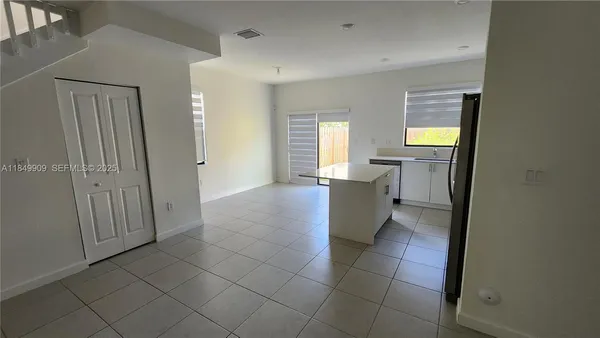 a bathroom with a sink mirror and a bathtub