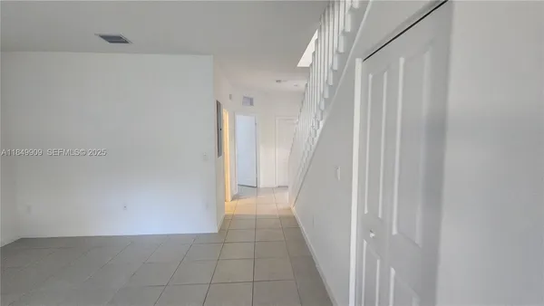 a view of a hallway with staircase