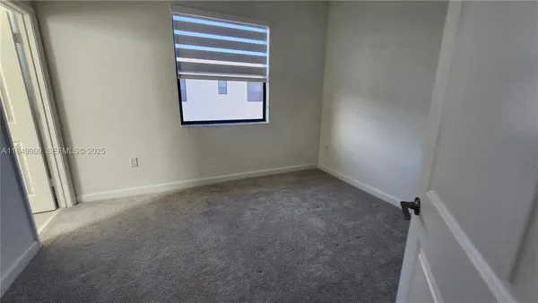 a view of empty room with window