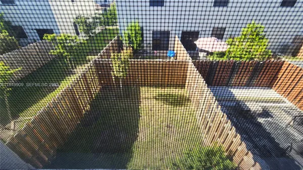 a view of a bathroom with wooden fence