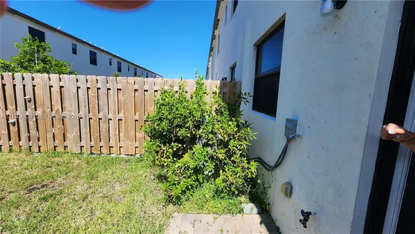 a view of a house with a flower garden