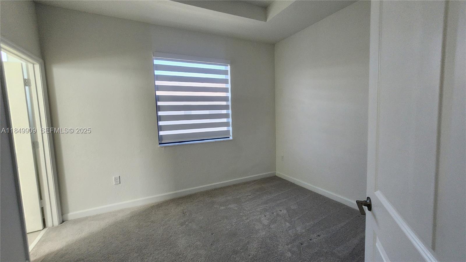 12897 Southwest 234th Street, Unit 12897 Homestead, FL 33032 - Photo 10 of 24 a view of room and window