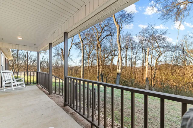 a kitchen with stainless steel appliances granite countertop wooden cabinets a stove top oven a sink and dishwasher