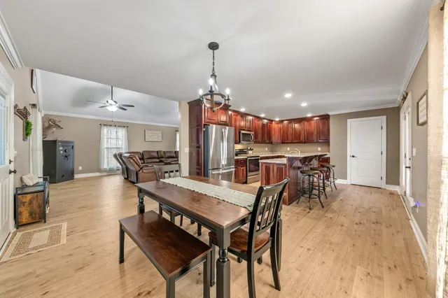 a view of a livingroom with furniture window and wooden floor