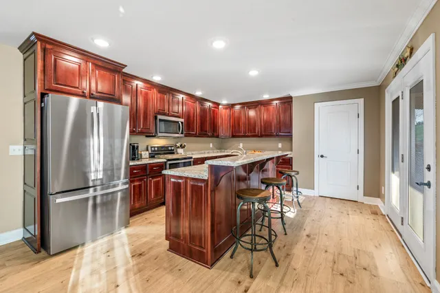a bedroom with a bed and ceiling fan