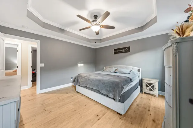 a view of a lush green field with mountains in the background