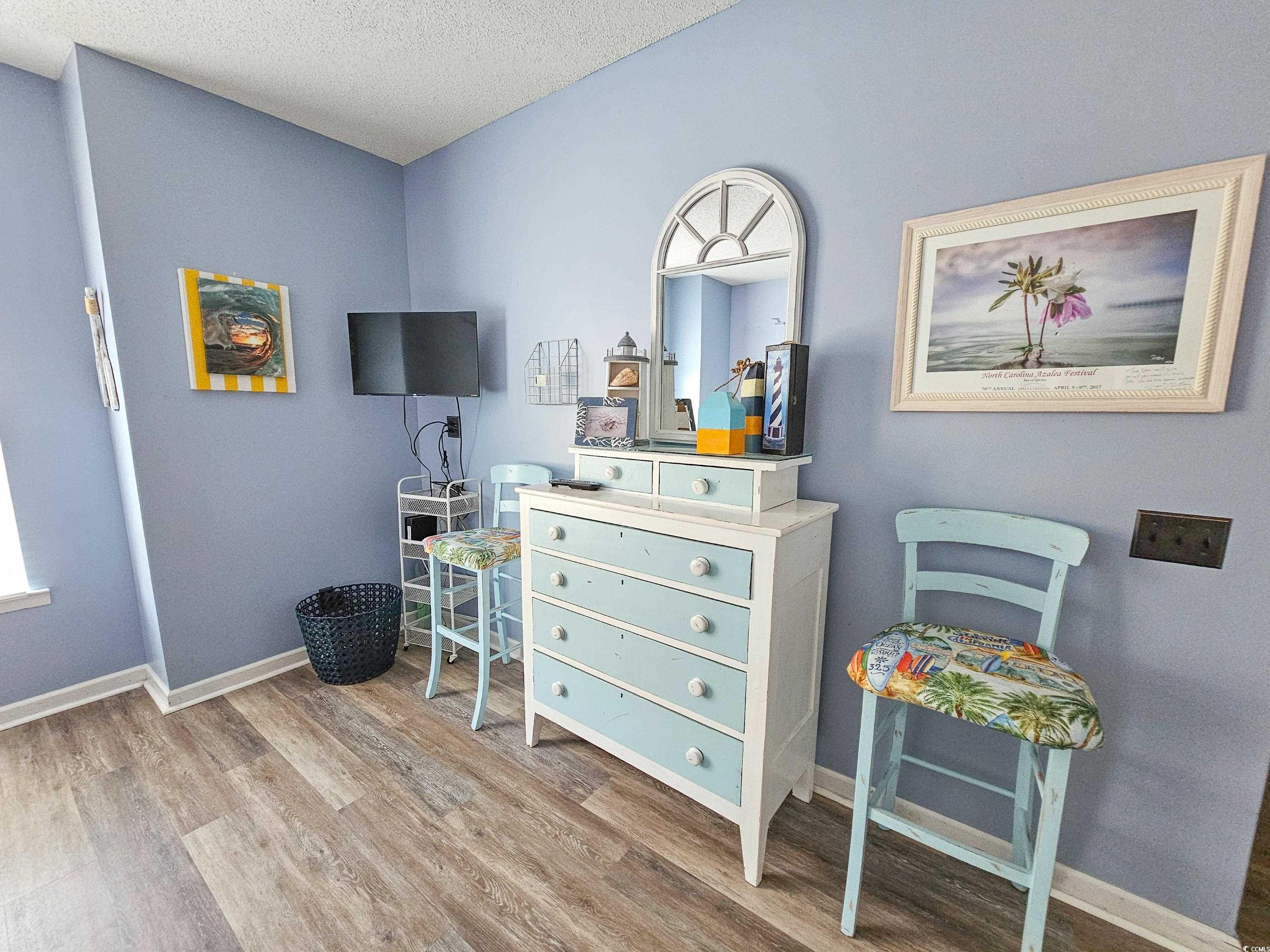 800 Castleford Circle, Unit 1E Myrtle Beach, SC 29572 - Photo 23 of 40 Interior space with baseboards, wood finished floors, and a textured ceiling