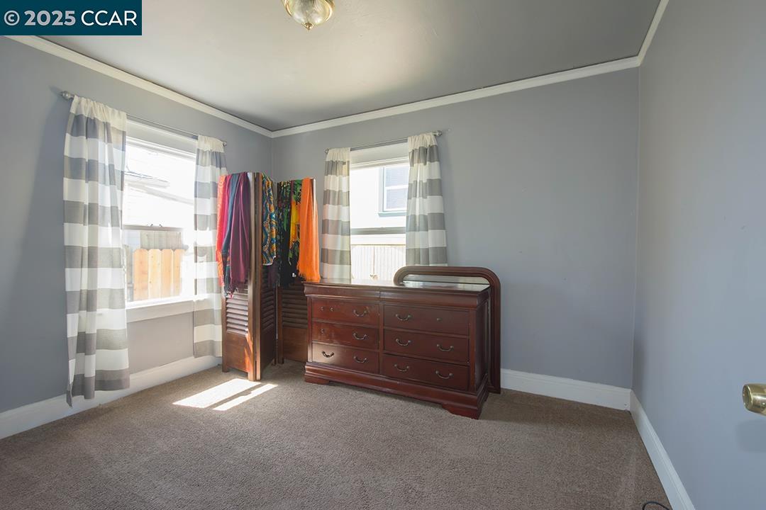 Melrose Heights Oakland, CA 94621 - Photo 11 of 34 a room with furniture and a window