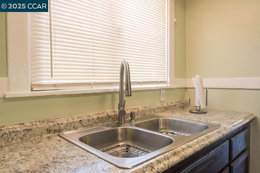 Melrose Heights Oakland, CA 94621 - Photo 20 of 34 a kitchen with a sink and a window