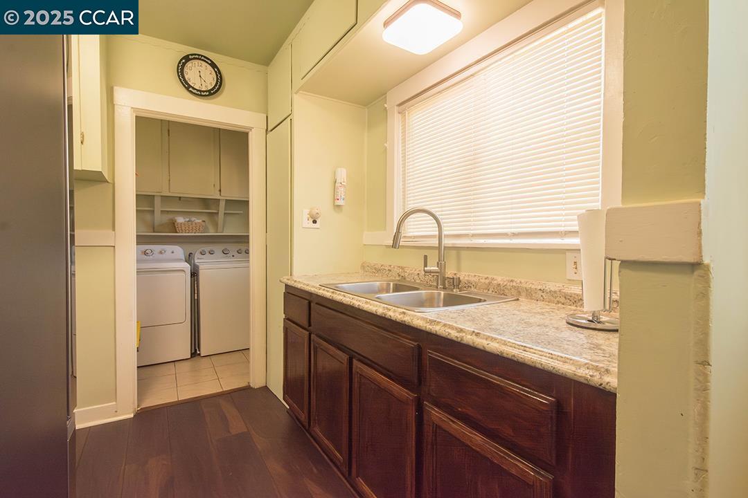 Melrose Heights Oakland, CA 94621 - Photo 21 of 34 a kitchen with a sink and a refrigerator