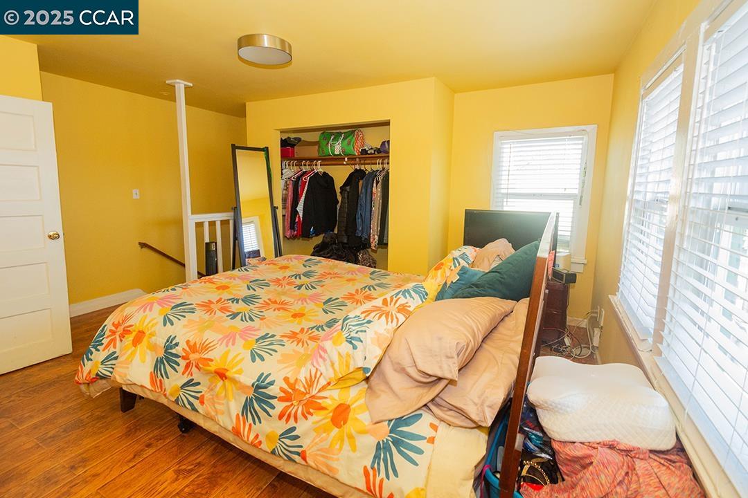 Melrose Heights Oakland, CA 94621 - Photo 28 of 34 a bed sitting in a bedroom next to a window